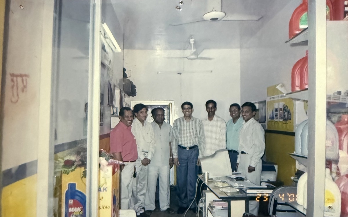 Inside Lubes Centre shop — MAK lubricants on shelves, team photo